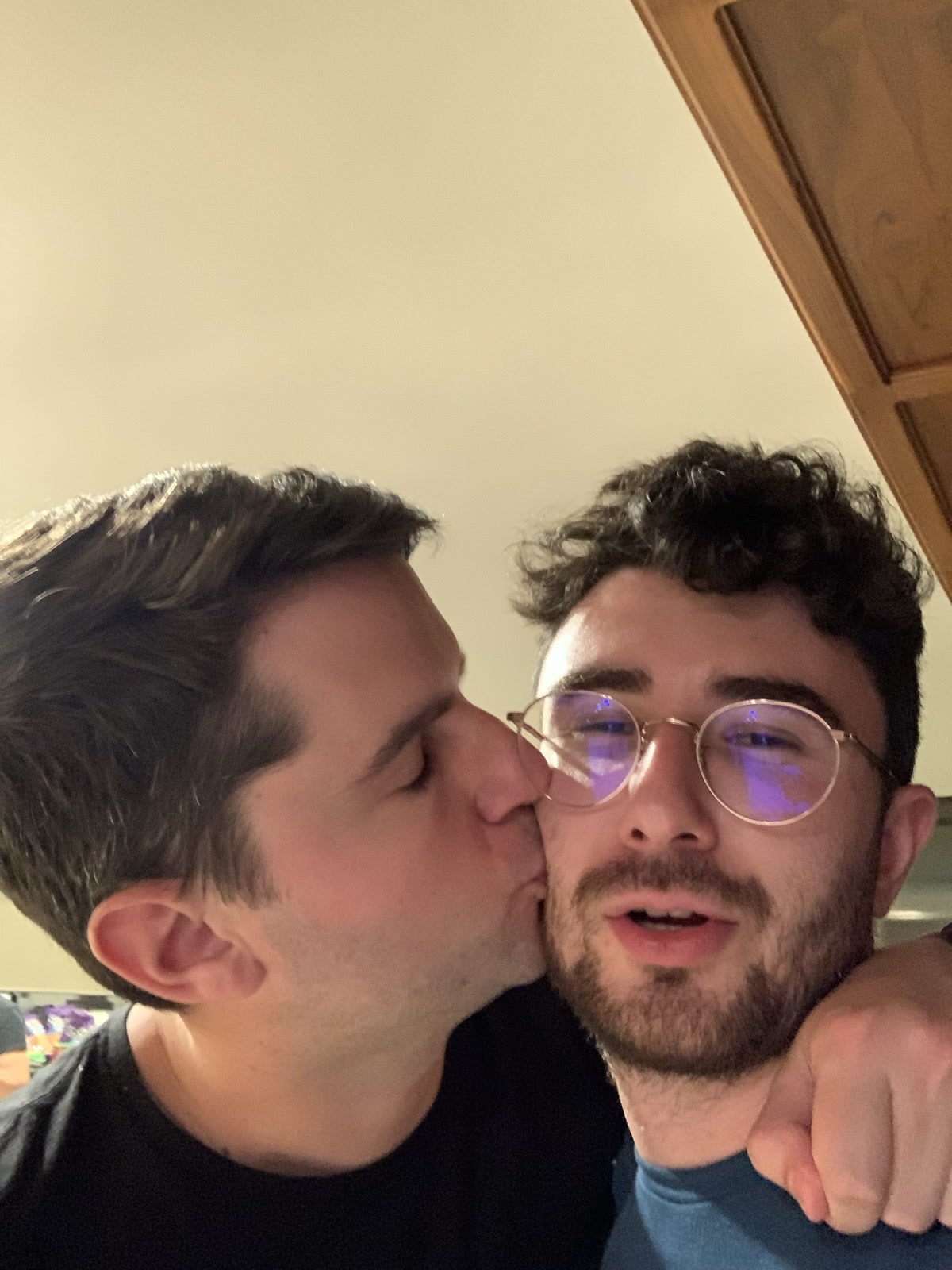 One of the lads planting a kiss on Alex's cheek